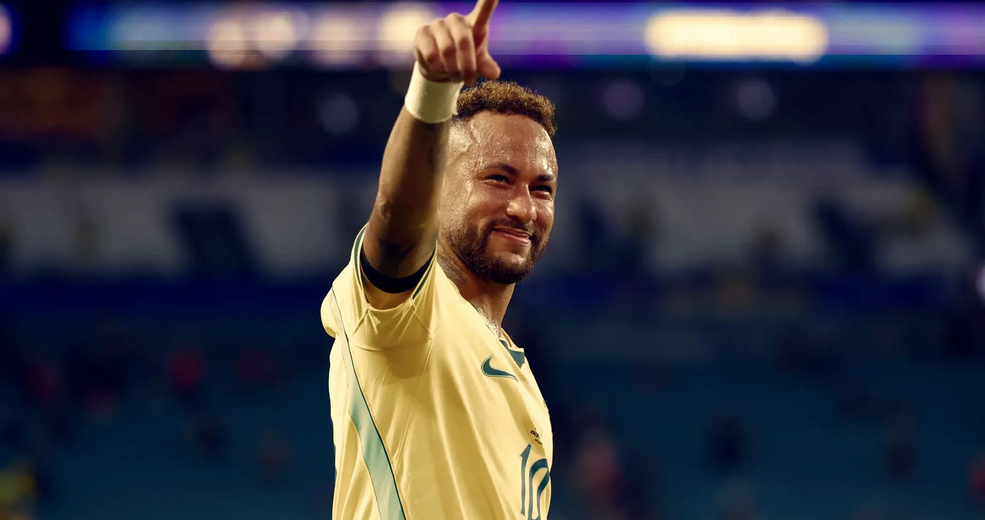 Jugador de fútbol celebrando con el dedo apuntando