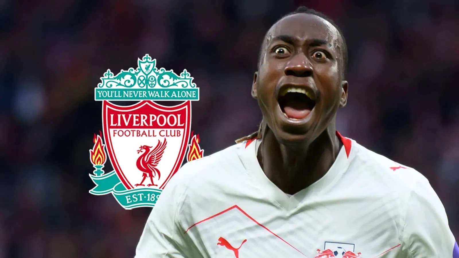 Jugador celebrando con el logo de Liverpool detrás