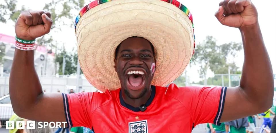 Fan celebrating with sombrero at football event